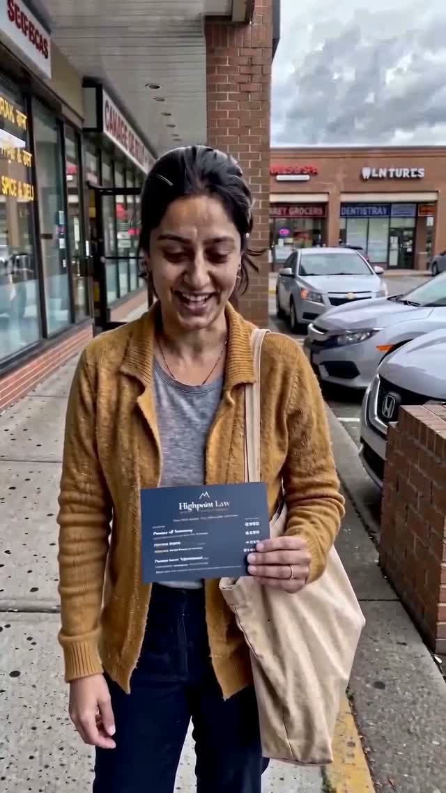 Street interview subject holding a flat-fee card